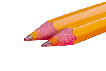 two yellow pencils with pink tips on a pink surface