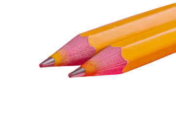 two yellow pencils with pink tips on a pink surface
