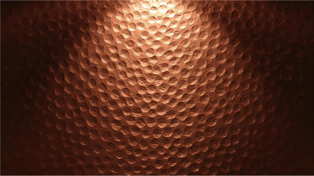 Close-up of a textured hammered copper surface with warm metallic sheen and intricate dimpled pattern.