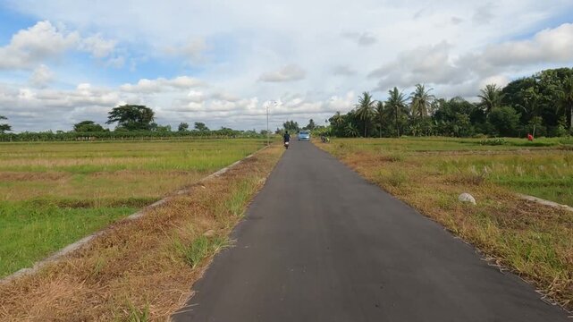 POV Motorcycle Riding: Java, Indonesia, South East Asia: Riding Motorcycle POV in Wide Open Farming Area