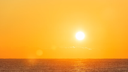 Bright Yellow Sunrise Sun Over Calm Ocean