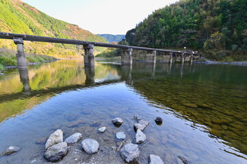 Aso Chinkabashi Submersible Bridge Over Mountain River in Kochi Prefecture, Shikoku Island. Rural River Landscape in Shikoku Island