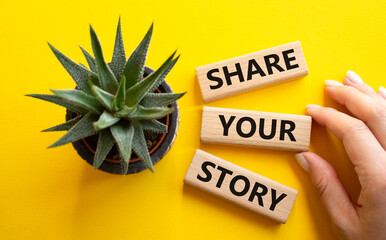 Share your story symbol. Wooden blocks with words Share your story. Beautiful yellow background...