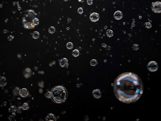 Floating bubbles against dark background