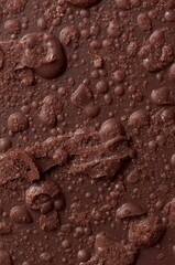 Close up of rich textured dark chocolate with varied surface formations