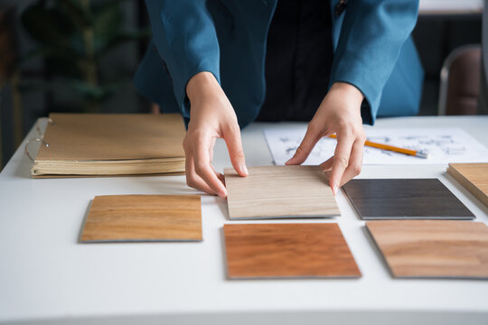 Interior designers brainstorming creative design ideas for modern home in collaborative meetingใ - Powered by Adobe