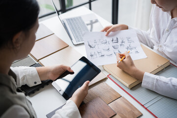 Interior designers brainstorming creative furniture design ideas in collaborative meeting