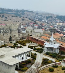 Aerial view over Rabati Castle complex in Akhaltsikhe, Georgia, revealing fortified walls, historic buildings, gardens, and the layered architecture of the restored medieval citadel