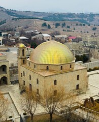 Top view of the Ahmediye Mosque inside Rabati Castle, Georgia, showing its domed roof, minaret, and the geometric layout of the historic fortress complex from above