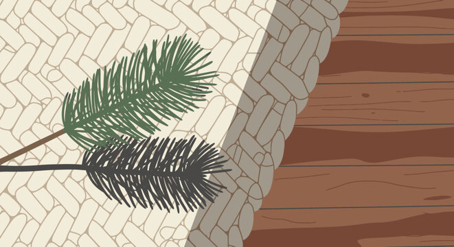 Close-up of two pine branches, one green and one dark, against a textured background of woven material and wood.