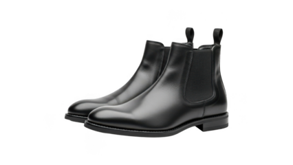 A pair of black leather chelsea boots with elastic sides and pull tabs isolated on transparent background