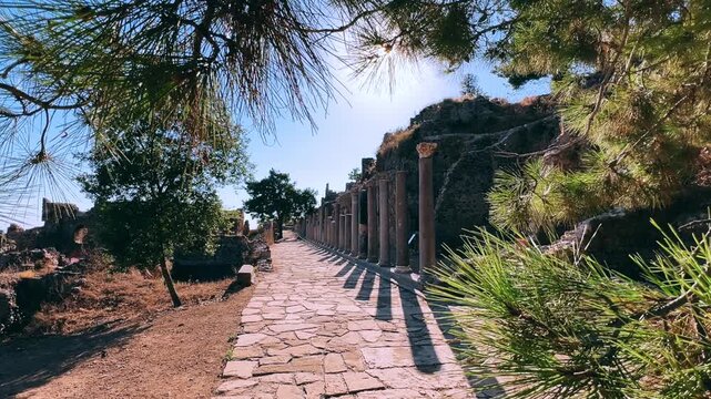 Ruins of the ancient Roman port city of Siedra in Alanya, Antalya, Turkey. The street and ruins of the ancient abandoned ancient city of Siedra on the Mediterranean coast. 4К