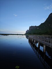Obraz premium Wooden boardwalk path over freshwater marsh at Khao Sam Roi Yot National Park, Thailand