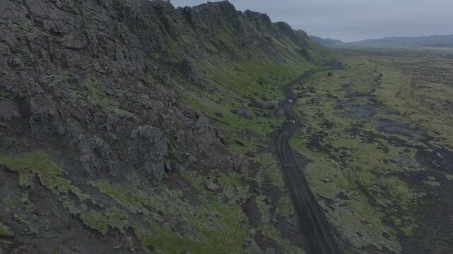 Drone ascending over misty Icelandic peaks, highlands overview - aerial 4k shot