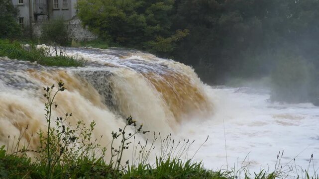 Rushing Waters Of The Inagh (Cullenagh) River Through Ennistymon Town In County Clare, Ireland. Static Shot