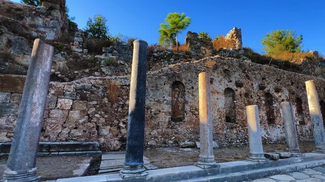 Ruins of the ancient Roman port city of Siedra in Alanya, Antalya, Turkey. The street and ruins of the ancient abandoned ancient city of Siedra on the Mediterranean coast. 4К