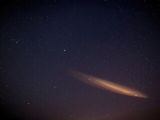 Glowing comet in starry night sky
