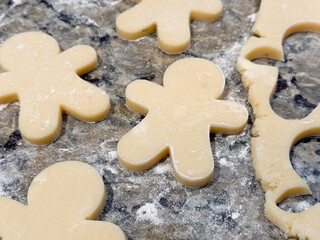 Sugar Cookies Being Rolled and Cut Out on the Kitchen Counter