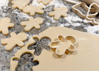 Sugar Cookies Being Rolled and Cut Out on the Kitchen Counter