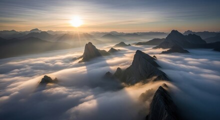 Spectacular alpine landscape with jagged peaks piercing a sea of clouds at sunrise beauty