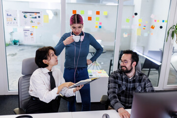 Business team collaborating in a modern office setting with discussions and brainstorming on project strategies and ideas during the working hours