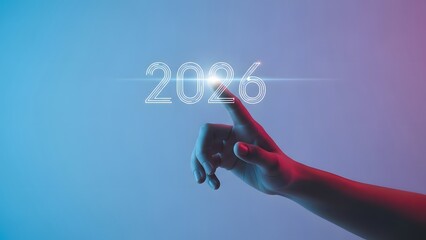 A human hand reaches to touch the glowing digital year 2026, set against a vibrant futuristic gradient background.