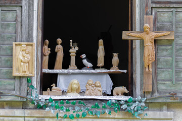 Wooden religious carvings, animals, and decorative figures