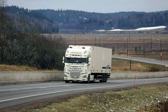 Highway Landscape with White DAF XF Truck Semi Trailer Delivering Goods. 