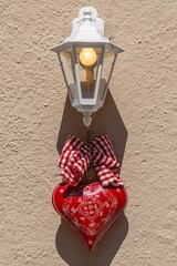 Wall lantern with red decorative heart