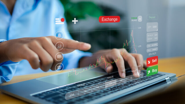 Investor Using Laptop for Online Stock Market Trading and Cryptocurrency Exchange - Powered by Adobe