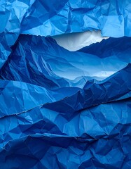 Deep blue, crumpled paper revealing a lighter, layered interior