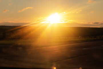 orange evening views of the road highway on a sunny day in summer. 