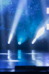 Obraz premium An empty stage of the theater, lit by spotlights and smoke before the performance