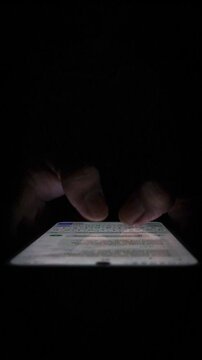 Night, cybersecurity and hands typing with phone for texting, internet troll or person cyberbullying. Dark comment, social media netizen or keyboard warrior, online bullying or hacking. vertical.