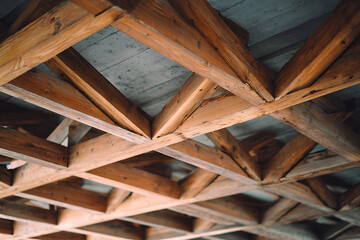 Wooden ceiling beams creating geometric lattice structure
