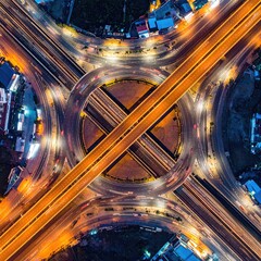 Aerial view of a complex highway intersection at night