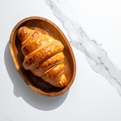 Golden croissant in wooden bowl on marble (8)