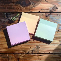 Pastel sticky notes on rustic wood