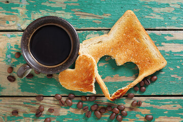 Coffee and toast with a heart-shaped cutout