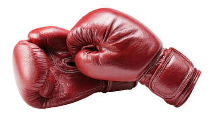 A pair of well-worn, glossy red boxing gloves, one resting on the other against a black background
