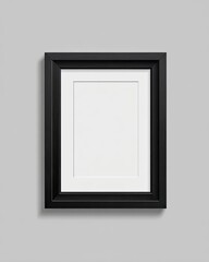 Black framed, white matted, empty picture frame on gray wall
