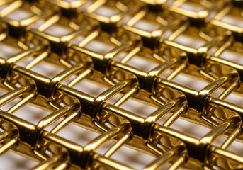 Golden Interlocking Mesh with Reflective Surface and Woven Pattern