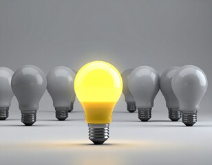 One illuminated light bulb stands out amongst a row of unlit bulbs