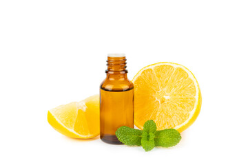 Lemon essential oil in a bottle with sliced ​​lemon and leaves isolated on a white background. Lemon oil. Perfume bottle with aromatic essential oil. Serum, lemon extract. Vitamin C. 