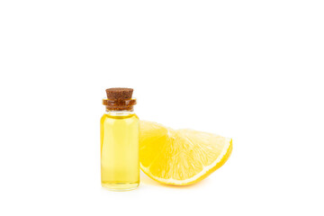 Lemon essential oil in a bottle with sliced ​​lemon and leaves isolated on a white background. Lemon oil. Perfume bottle with aromatic essential oil. Serum, lemon extract. Vitamin C. 