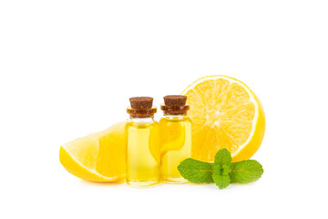 Lemon essential oil in a bottle with sliced ​​lemon and leaves isolated on a white background. Lemon oil. Perfume bottle with aromatic essential oil. Serum, lemon extract. Vitamin C. 