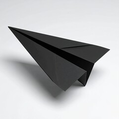 A minimalist studio shot of a folded paper airplane casting a shadow