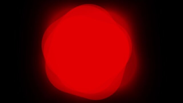 Abstract bright glowing red organic blob shape on a solid black background