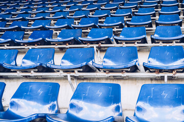 Empty Blue Stadium Seats in Sports Arena