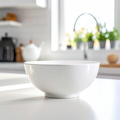 Empty white bowl on a clean kitchen counter, blurred background